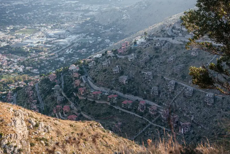 Aerial view over the abandoned villas and winding roads of Pizzo Sella above Palermo